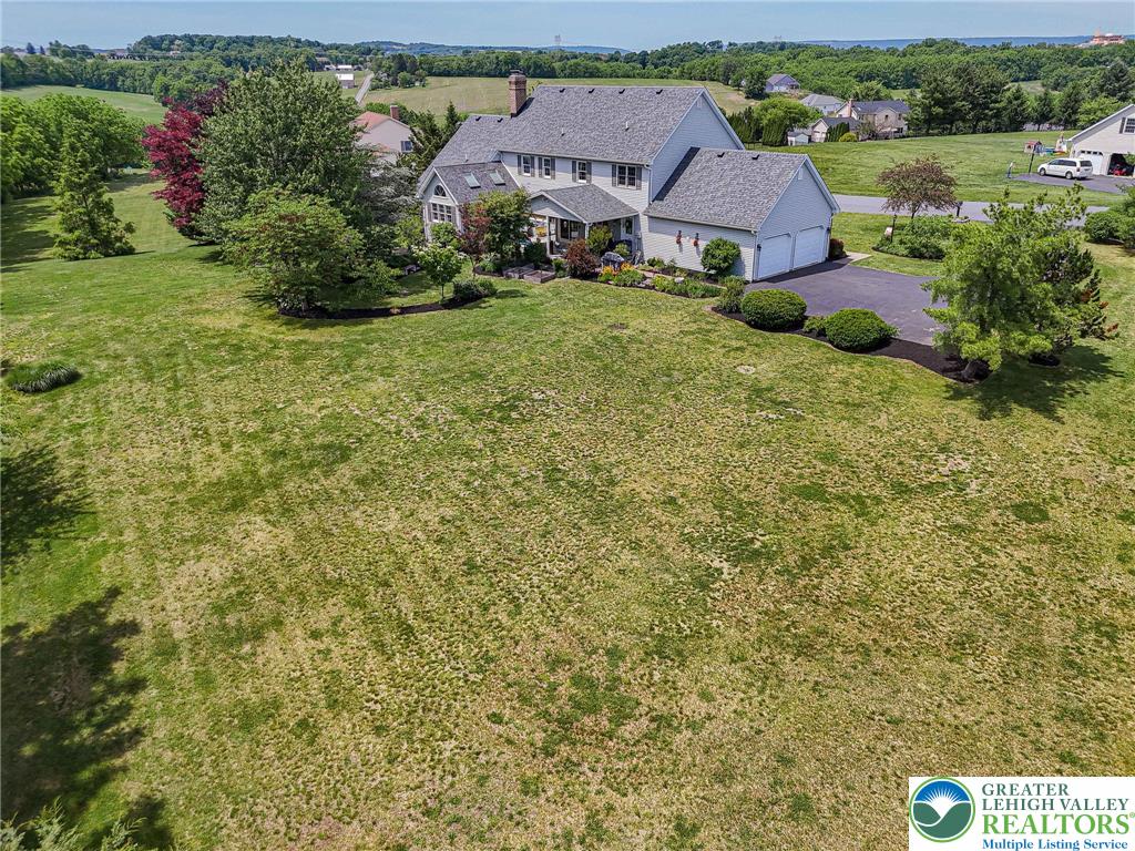 4542 Springfield Drive Coplay, PA 18037 - Photo 80 of 89 Perched on a verdant lot, this charming residence offers expansive green spaces and peaceful country views.