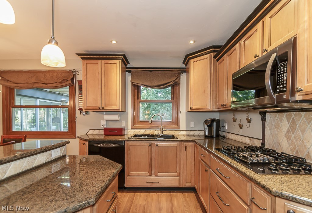 1023 Roland Road Lyndhurst, OH 44124 - Photo 6 of 33 Wow! Look at this beautiful kitchen! The countertops...cabinetry, gas cooktop and backsplash. Yes please!