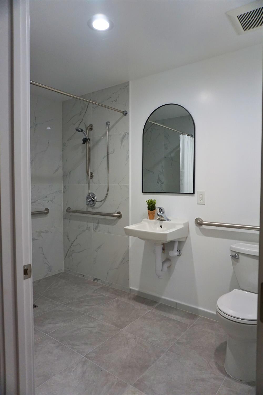 1917 Wingate Way Hayward, CA 94541 - Photo 12 of 15 a bathroom with a sink a toilet and shower