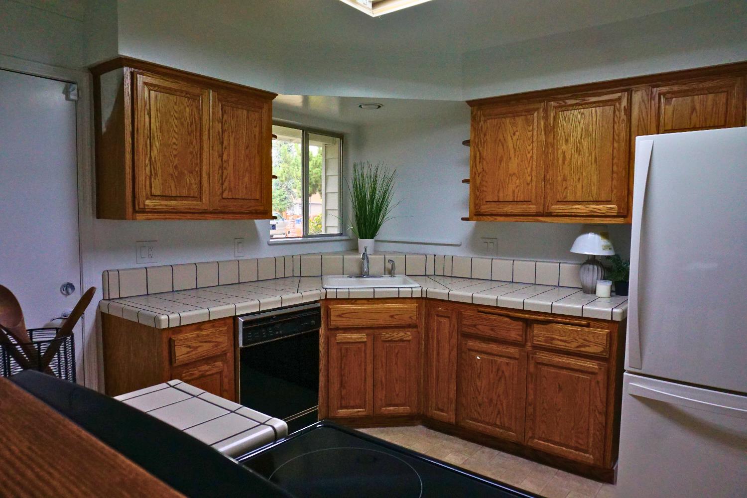 1917 Wingate Way Hayward, CA 94541 - Photo 5 of 15 a kitchen with a sink cabinets and wooden floor