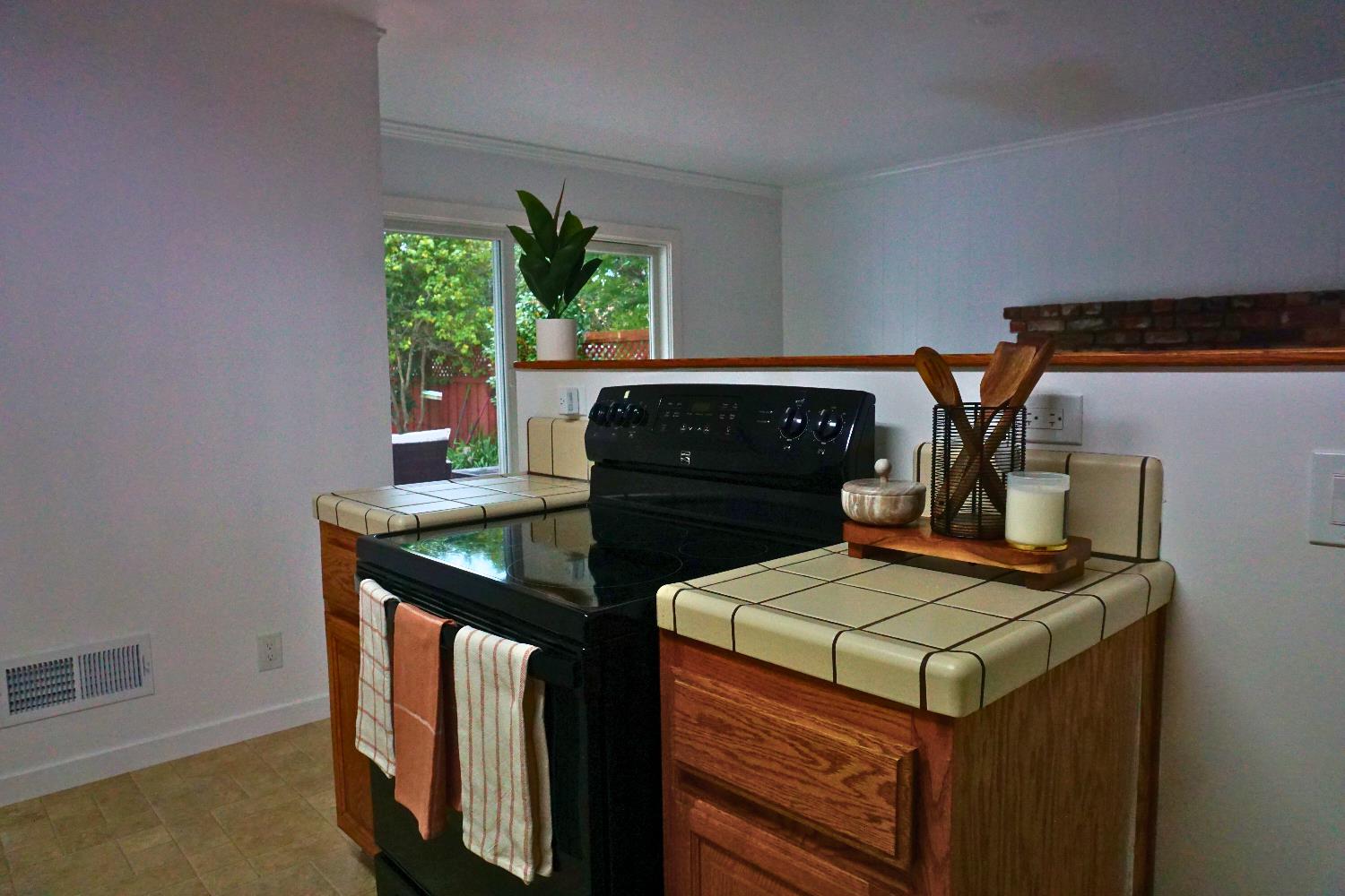 1917 Wingate Way Hayward, CA 94541 - Photo 6 of 15 a kitchen with a stove and a refrigerator