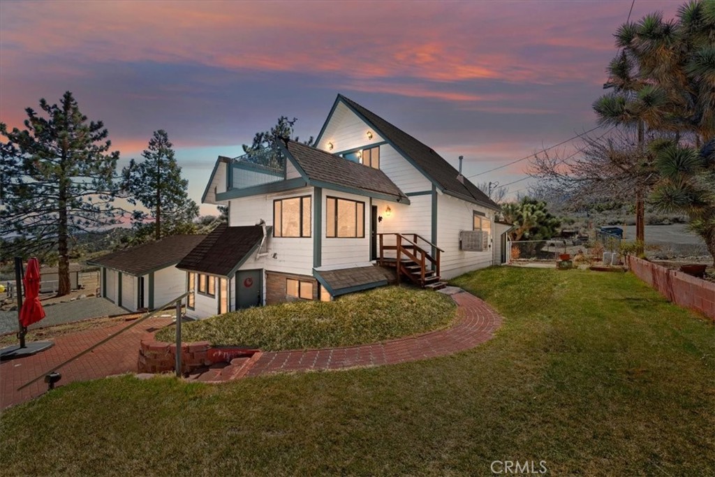 7337 Sequoia Road Wrightwood, CA 92397 - Photo 1 of 52 a front view of a house with a yard