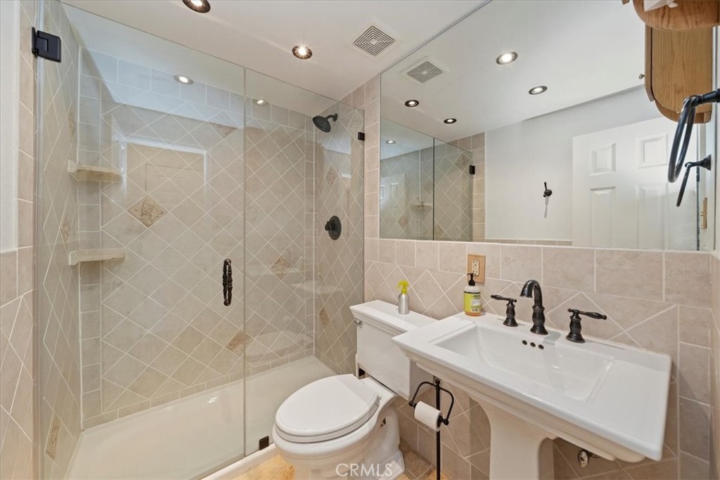 7337 Sequoia Road Wrightwood, CA 92397 - Photo 15 of 52 a bathroom with a sink toilet and shower