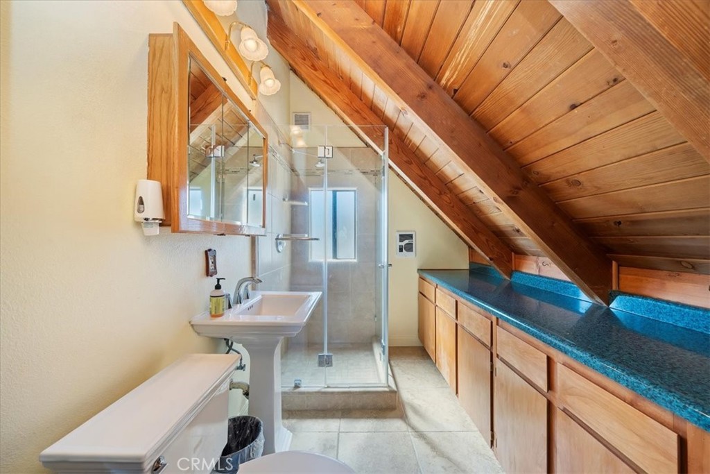7337 Sequoia Road Wrightwood, CA 92397 - Photo 19 of 52 a bathroom with a sink and a mirror