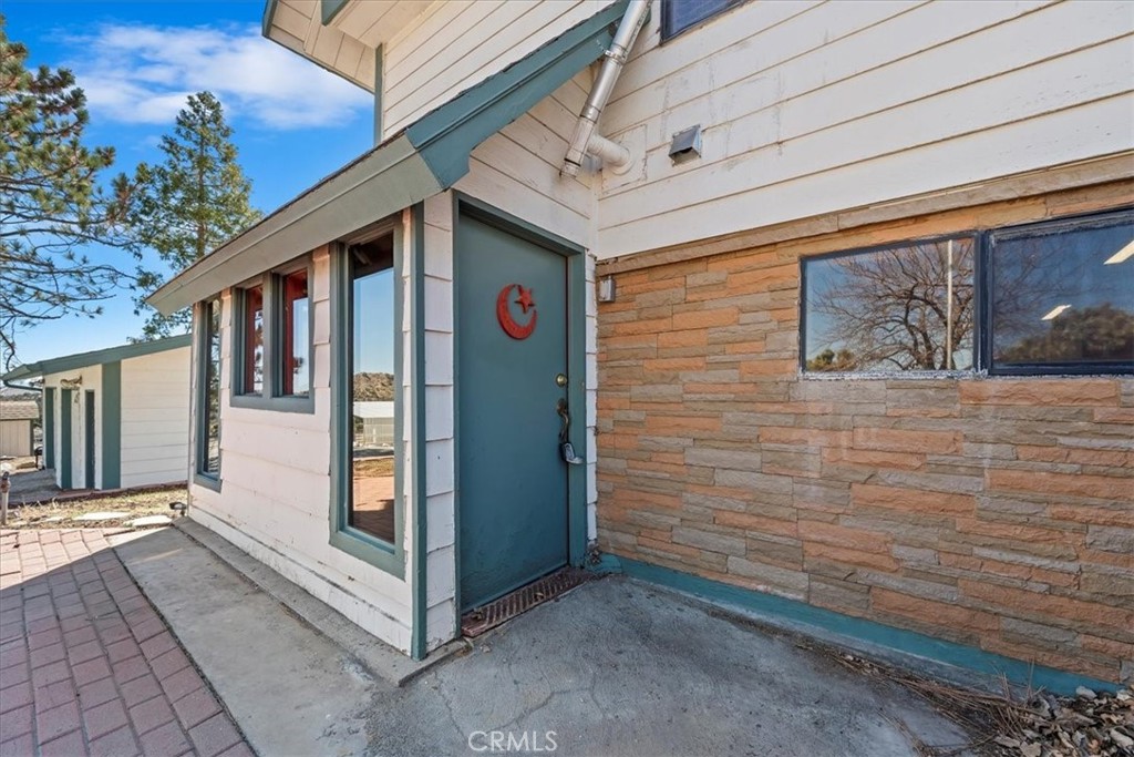 7337 Sequoia Road Wrightwood, CA 92397 - Photo 26 of 52 a view of a house with a door