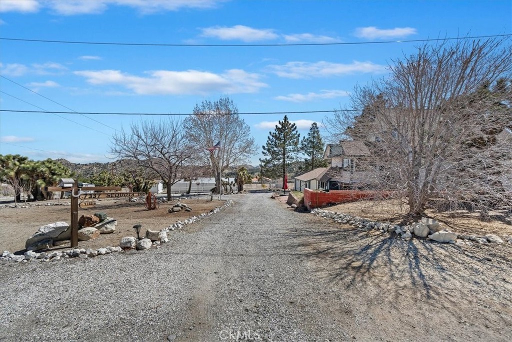 7337 Sequoia Road Wrightwood, CA 92397 - Photo 3 of 52 a car parked on the side of the road