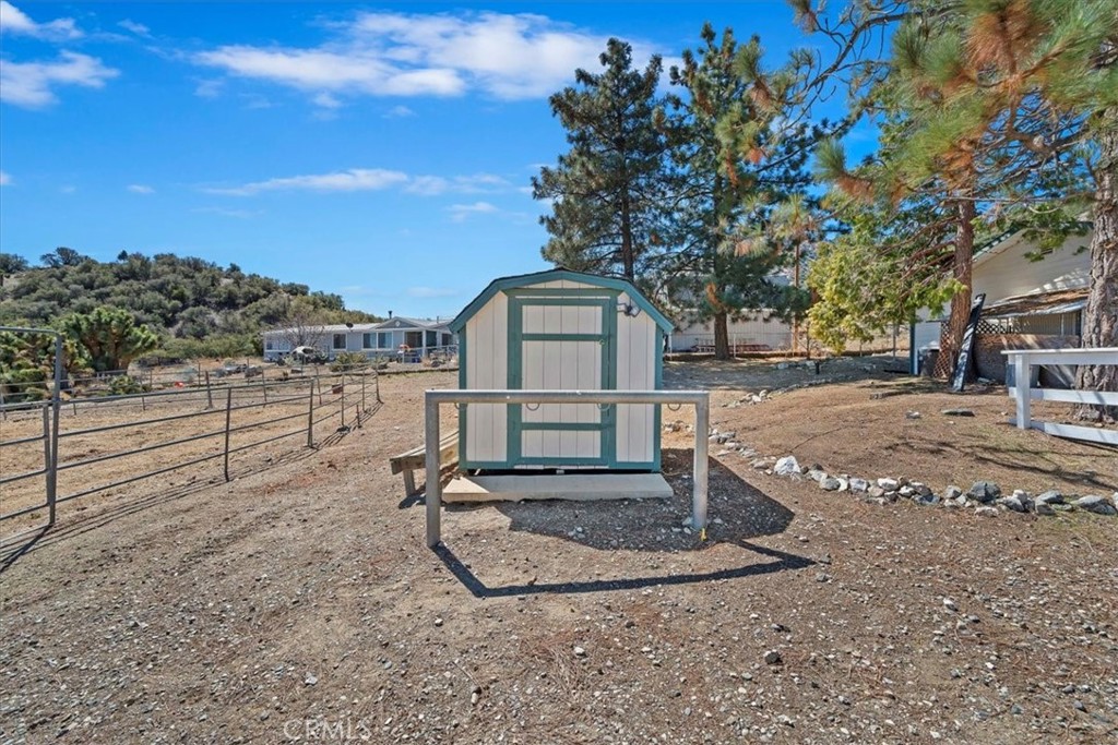 7337 Sequoia Road Wrightwood, CA 92397 - Photo 36 of 52 a front view of a house with a yard