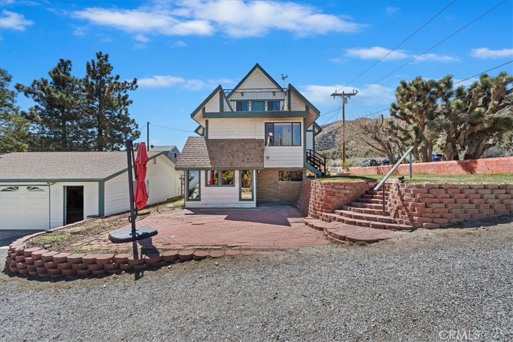 7337 Sequoia Road Wrightwood, CA 92397 - Photo 4 of 52 a front view of a house with a yard