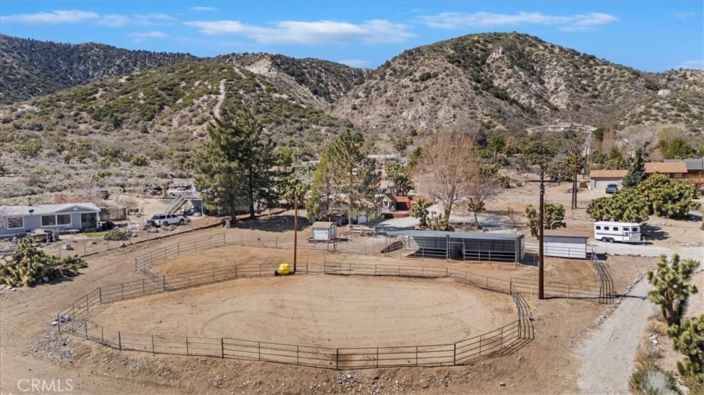 7337 Sequoia Road Wrightwood, CA 92397 - Photo 44 of 52 a view of a terrace with a bench and trees