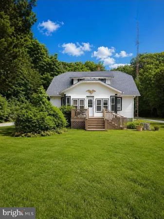 a view of a house with a big yard