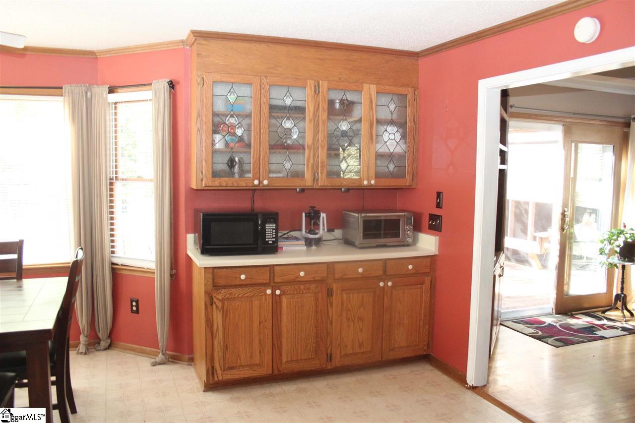 701 Hunters Hill Road Simpsonville, SC 29680 - Photo 14 of 36 This room is 13X14 with built in shelving, a hutch and a fireplace. It would be a perfect place to gather the friends and family together.