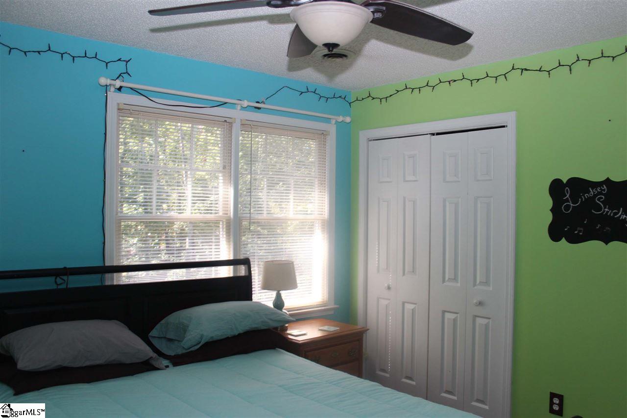 701 Hunters Hill Road Simpsonville, SC 29680 - Photo 22 of 36 This bedroom is located on the back side of the house and measures 12X11.5. The floors in this room are laminate hardwoods.