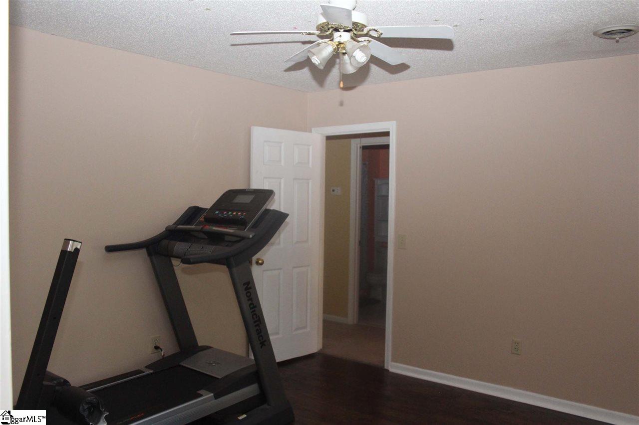 701 Hunters Hill Road Simpsonville, SC 29680 - Photo 23 of 36 This bedroom is located on the front side of the home and measures 12X11. It has 2 closets and a dormer seating area. The floors in this room are laminate hardwood.