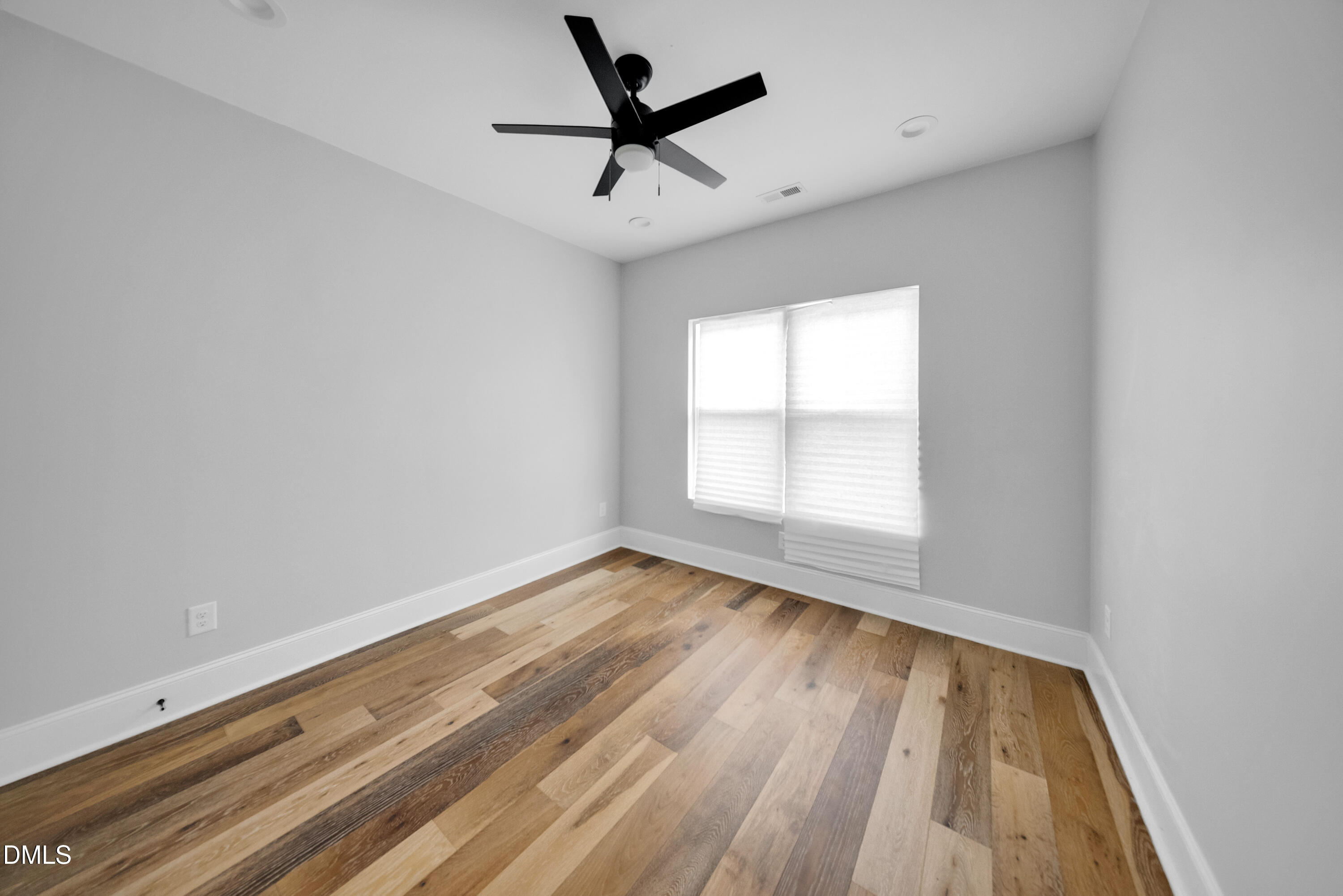 3908 Booker Avenue Durham, NC 27713 - Photo 19 of 71 wooden floor in an empty room with a window