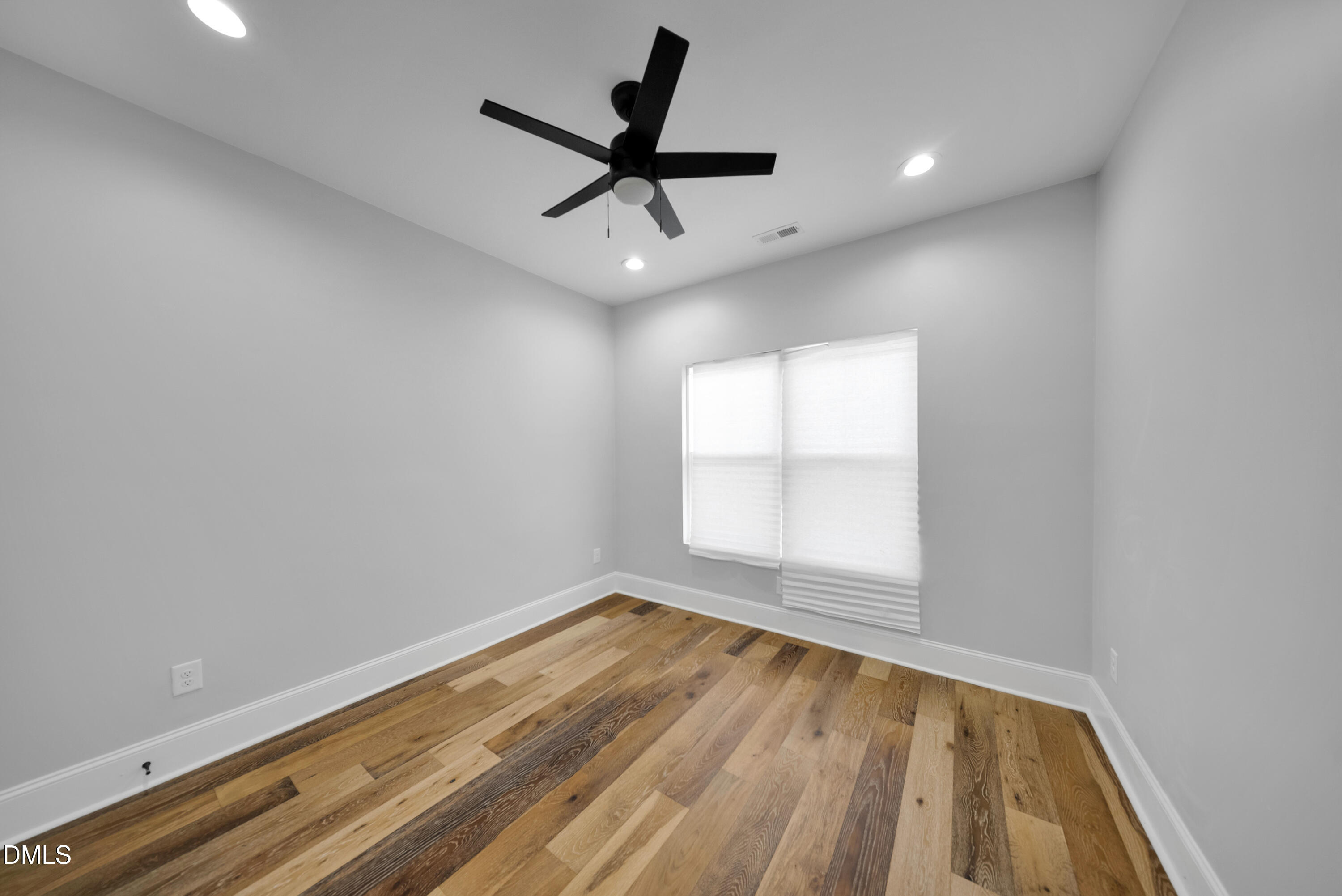 3908 Booker Avenue Durham, NC 27713 - Photo 25 of 71 an empty room with wooden floor and windows