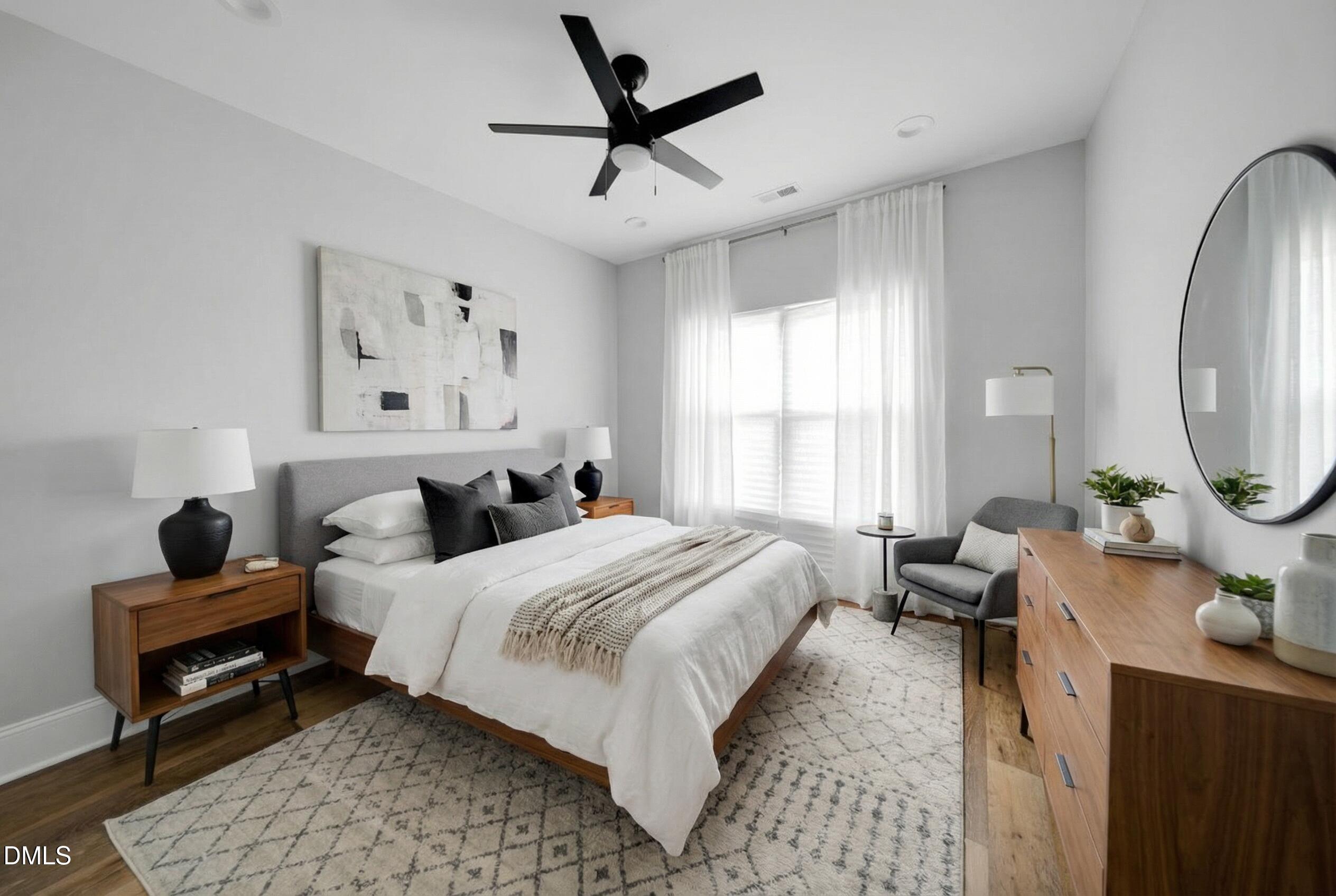 3908 Booker Avenue Durham, NC 27713 - Photo 26 of 71 a bedroom with a bed couch and a window