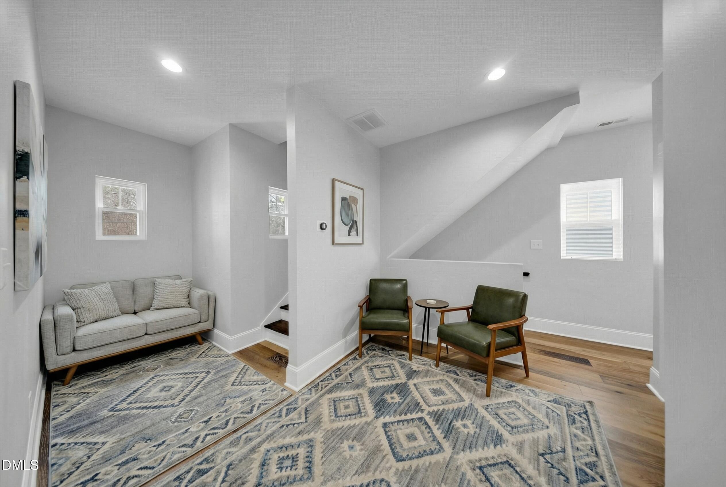 3908 Booker Avenue Durham, NC 27713 - Photo 29 of 71 a living room with furniture and wooden floor