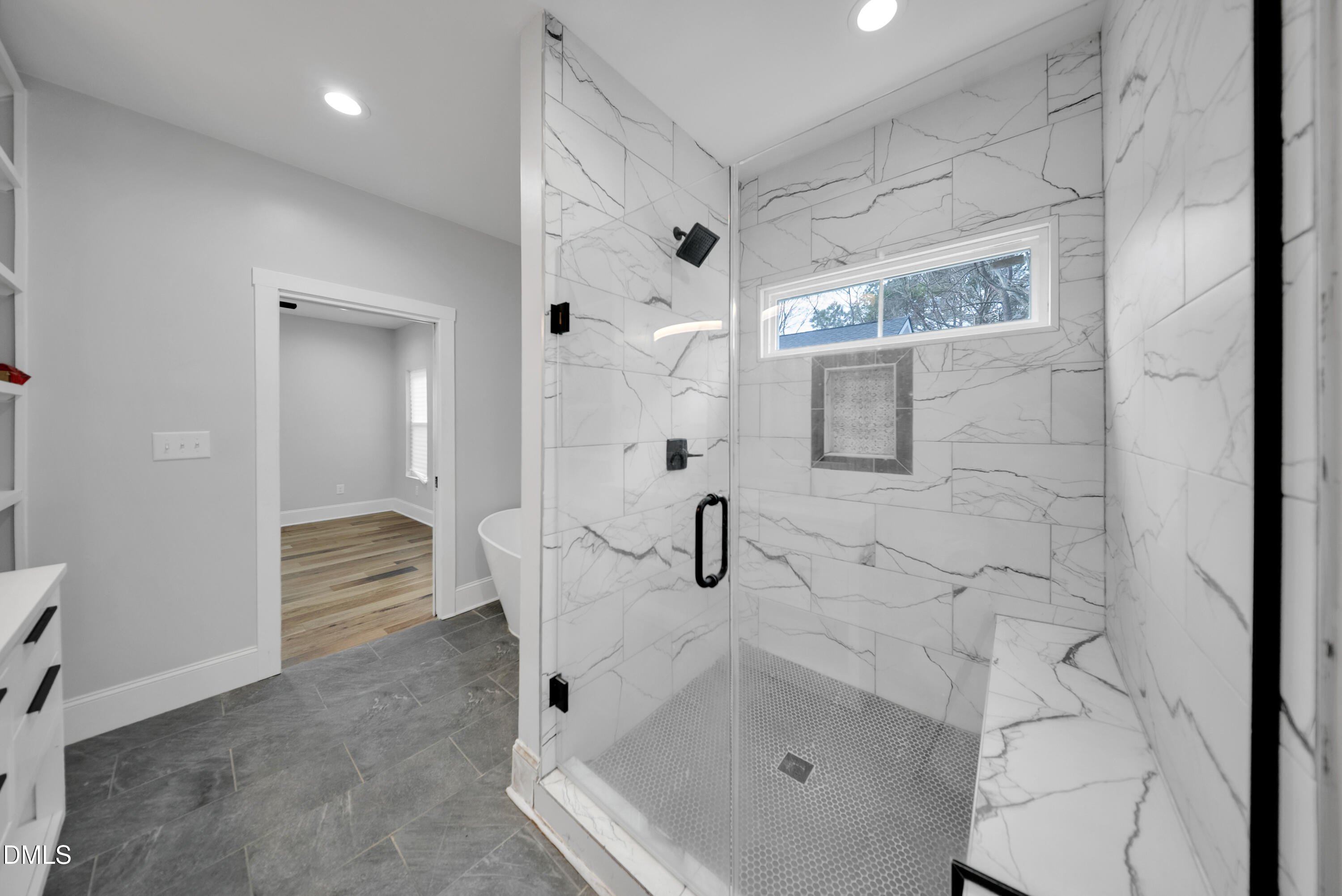 3908 Booker Avenue Durham, NC 27713 - Photo 39 of 71 a bathroom with a tub shower and vanity