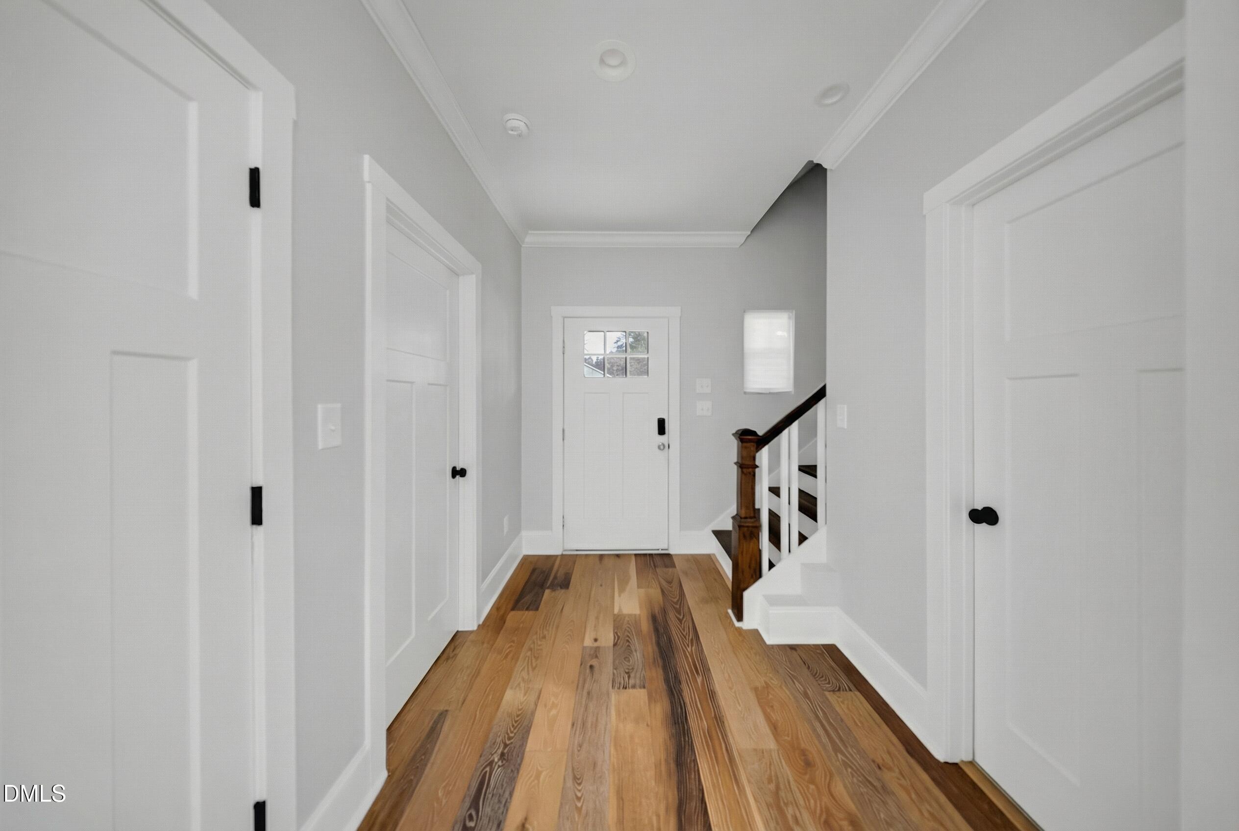 3908 Booker Avenue Durham, NC 27713 - Photo 4 of 71 a view of a hallway with wooden floor and staircase