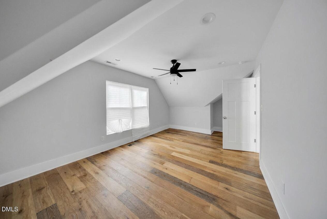 3908 Booker Avenue Durham, NC 27713 - Photo 48 of 71 a view of empty room with wooden floor and fan