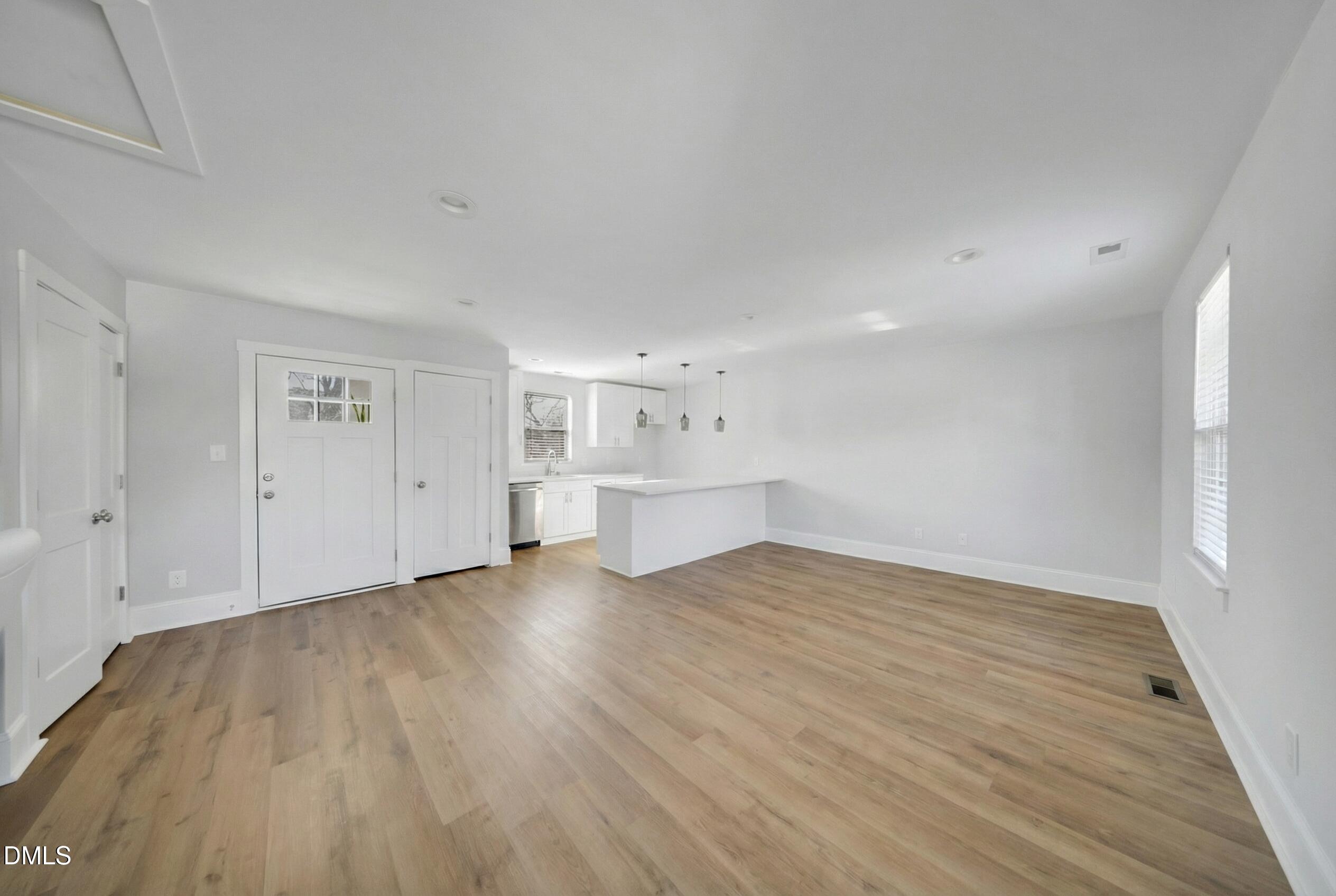 3908 Booker Avenue Durham, NC 27713 - Photo 65 of 71 a view of empty room with wooden floor