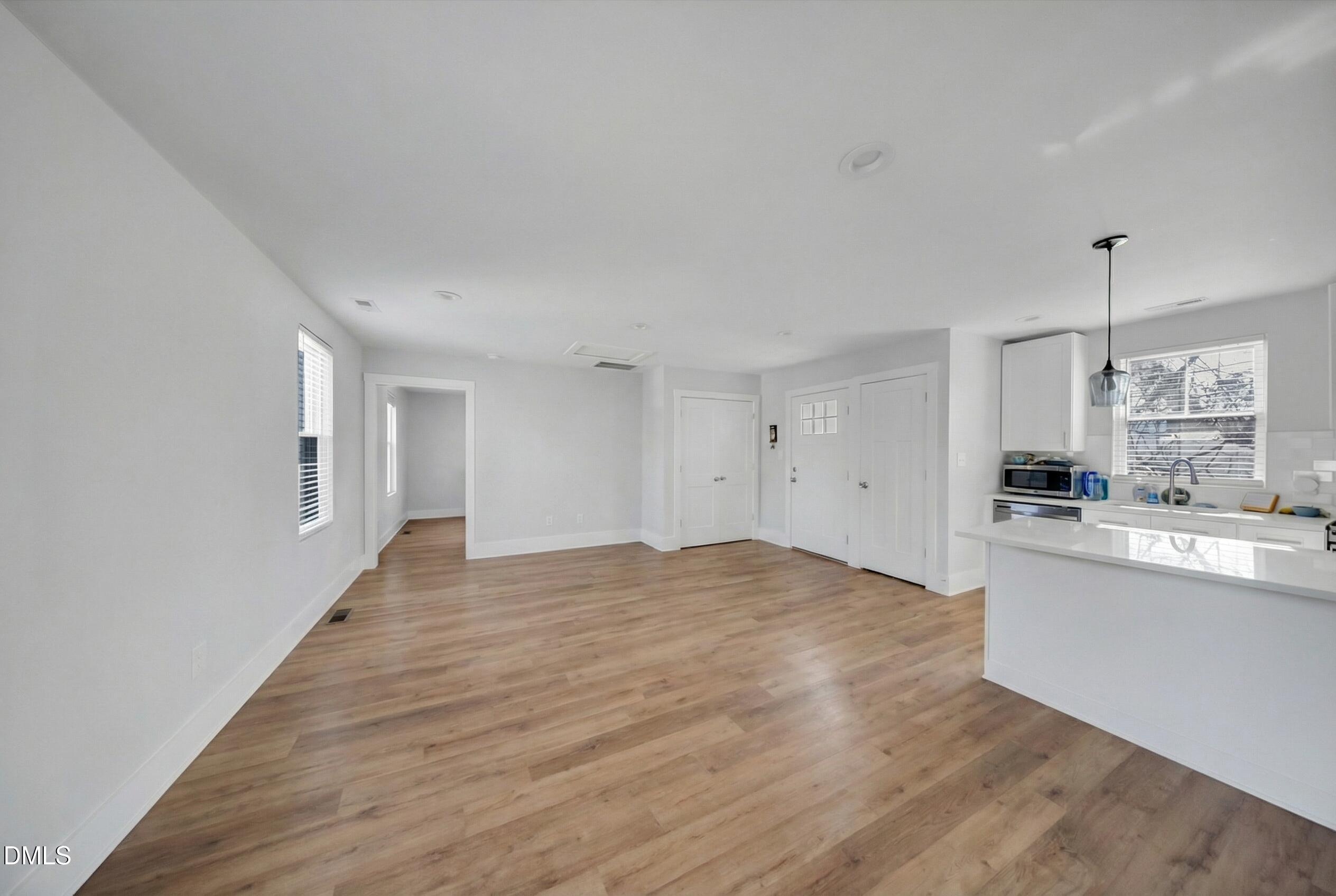 3908 Booker Avenue Durham, NC 27713 - Photo 66 of 71 a view of empty room with wooden floor and window