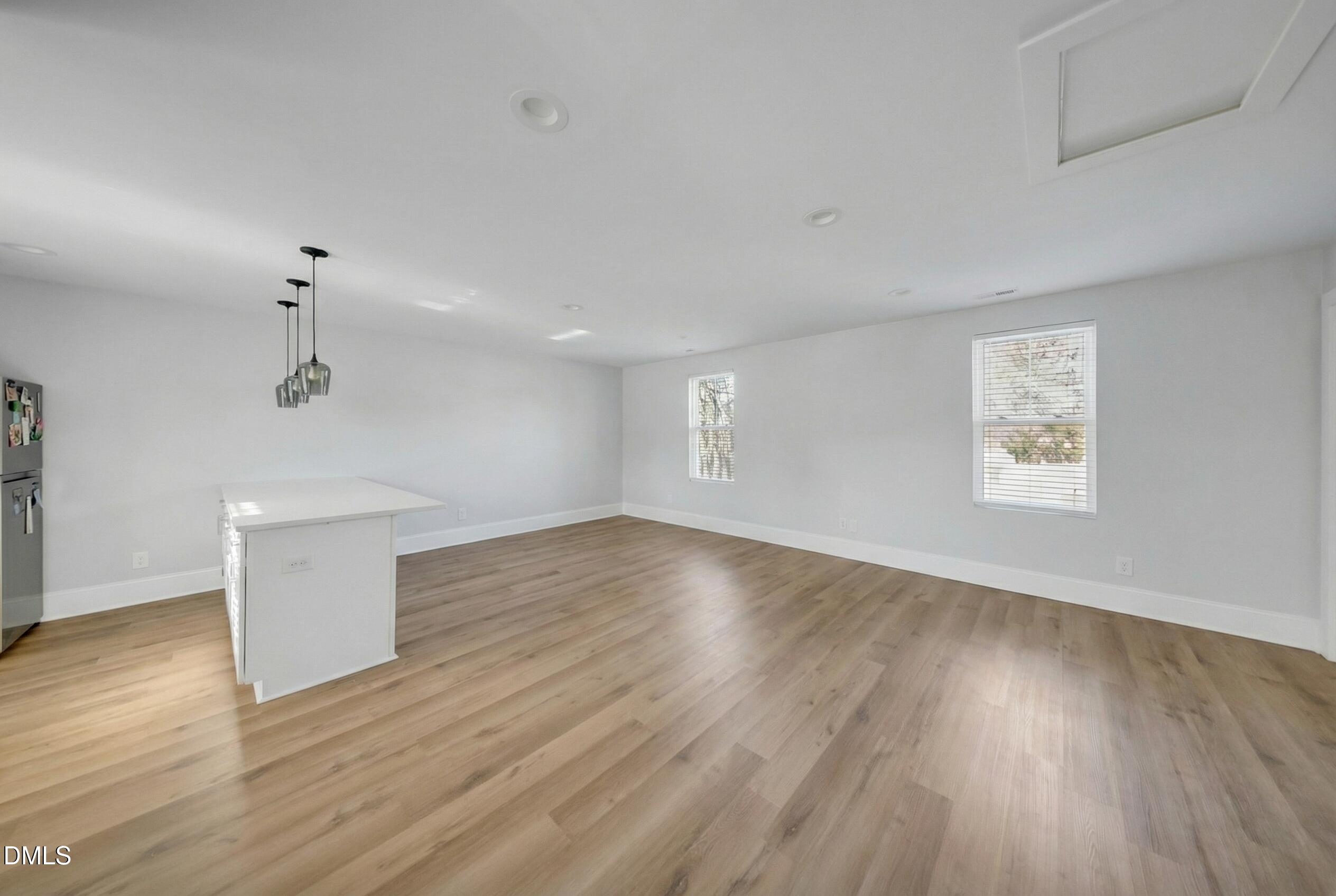 3908 Booker Avenue Durham, NC 27713 - Photo 68 of 71 a view of empty room with wooden floor and fan