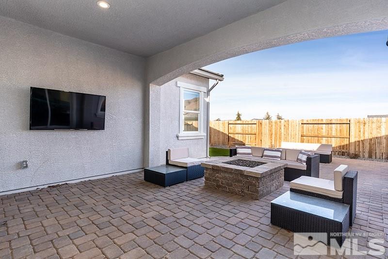 2337 Stone Rise Road Reno, NV 89521 - Photo 16 of 25 a living room with couches and a flat screen tv