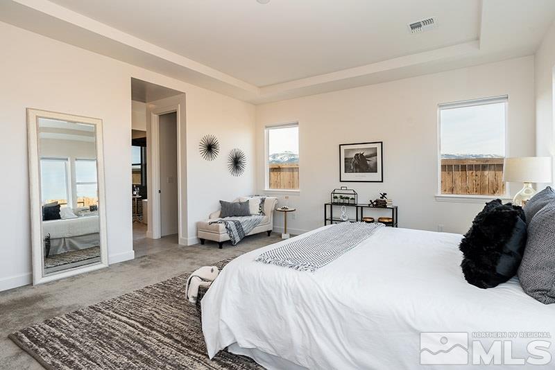 2337 Stone Rise Road Reno, NV 89521 - Photo 18 of 25 a bedroom with a bed and a couch