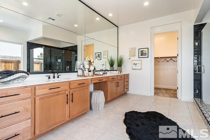 2337 Stone Rise Road Reno, NV 89521 - Photo 19 of 25 a spacious bathroom with a double vanity sink a mirror and a shower