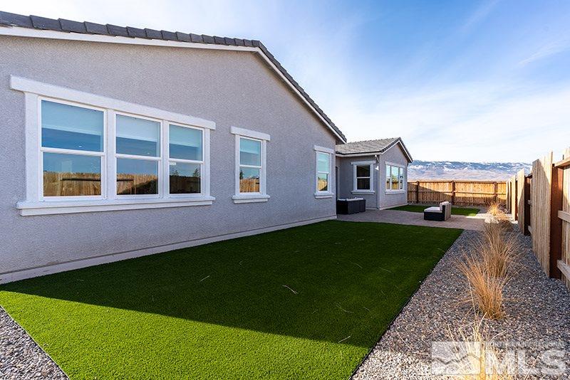 2337 Stone Rise Road Reno, NV 89521 - Photo 23 of 25 a front view of a house with a yard and trees