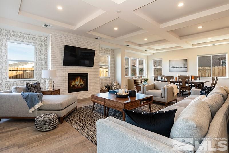 2337 Stone Rise Road Reno, NV 89521 - Photo 9 of 25 a living room with furniture fireplace and a flat screen tv