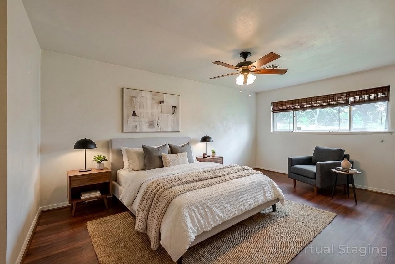 23126 Bayleaf Drive Spring, TX 77373 - Photo 20 of 43 a bedroom with a bed and a chandelier