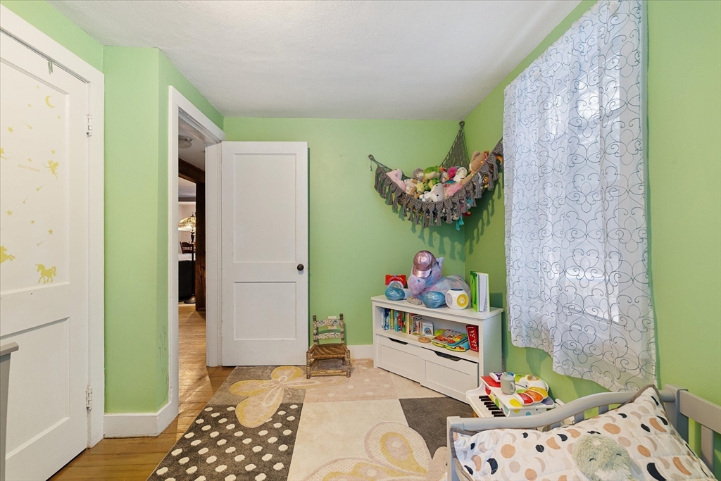 13 Morse Road Holland, MA 01521 - Photo 13 of 25 a bedroom with baby crib and hanging chair