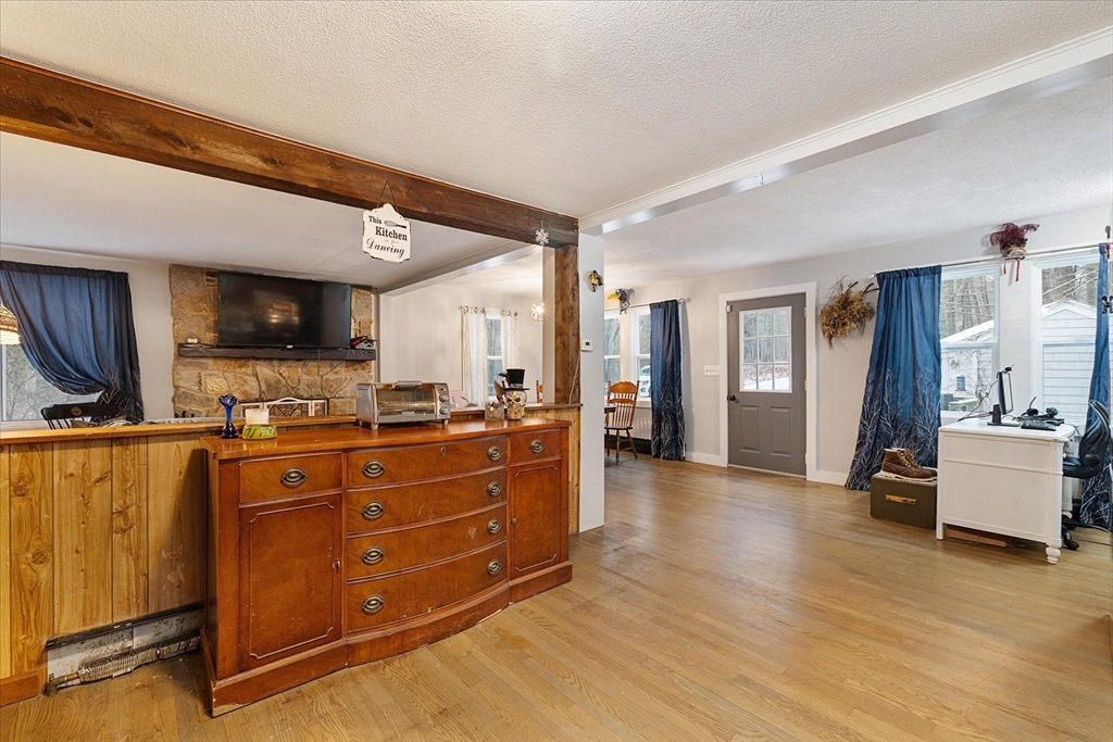 13 Morse Road Holland, MA 01521 - Photo 5 of 25 a large kitchen with stainless steel appliances granite countertop a refrigerator a stove and a wooden floors