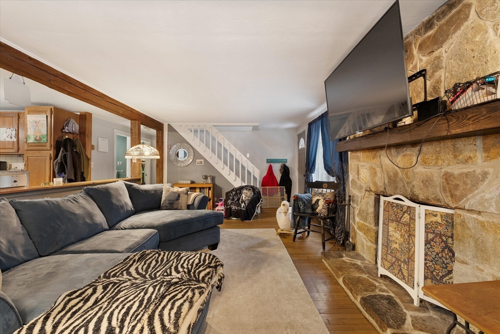 13 Morse Road Holland, MA 01521 - Photo 8 of 25 a living room with furniture and a wooden floor