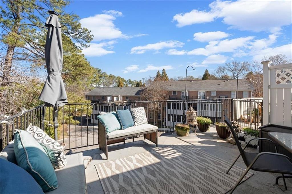 1101 Collier Road Northwest, Unit T5 Atlanta, GA 30318 - Photo 22 of 32 a view of a terrace with couches