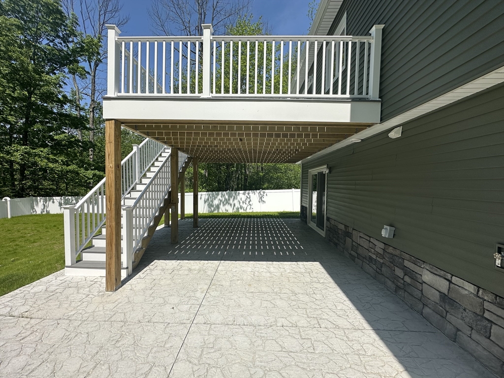 102 Wells Road Becket, MA 01223 - Photo 31 of 40 a front view of a house with a balcony