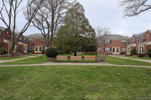 a house view with a sitting space and garden