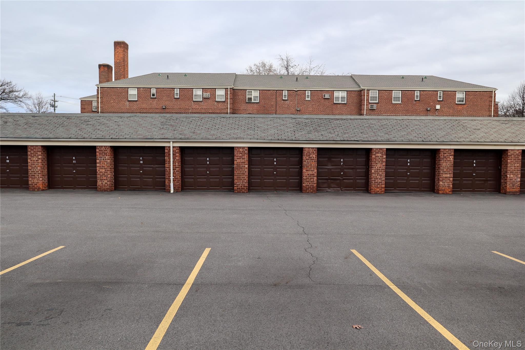 211-07 73rd Avenue, Unit 349 Queens, NY 11364 - Photo 4 of 6 a front view of a house with a large window