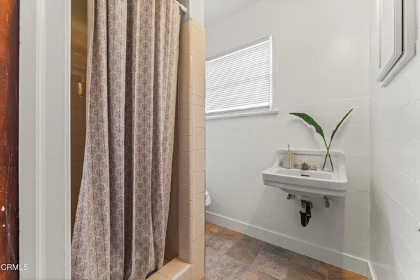 a bathroom with a sink and mirror