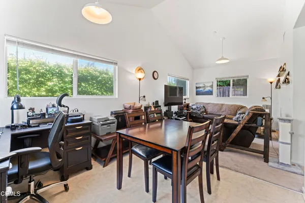 a view of a dining room with furniture window and outside view