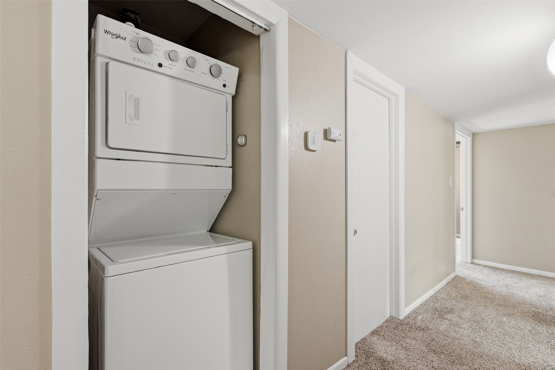 1509 Ridgemont Drive Austin, TX 78723 - Photo 17 of 28 Stacked laundry in the hall