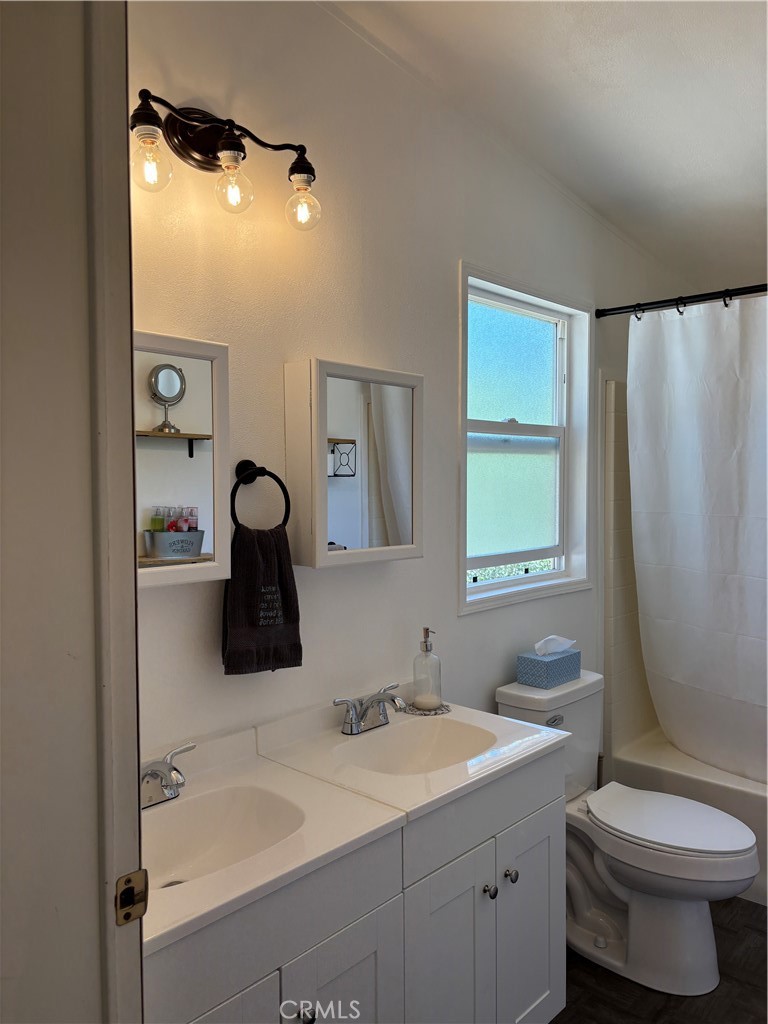 4060 Indian Peak Road Mariposa, CA 95338 - Photo 18 of 60 a bathroom with a sink toilet and mirror