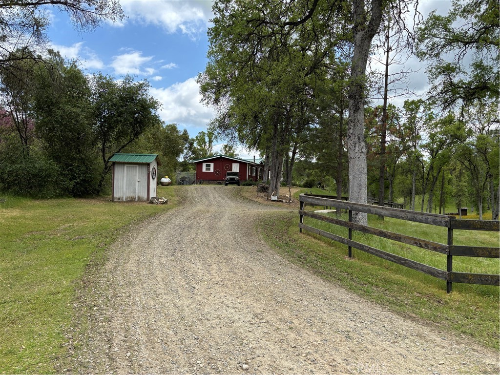 4060 Indian Peak Road Mariposa, CA 95338 - Photo 2 of 60 a view of a house with a yard and sitting area