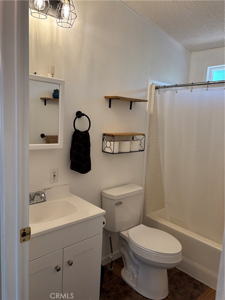 4060 Indian Peak Road Mariposa, CA 95338 - Photo 34 of 60 a bathroom with a toilet sink and mirror