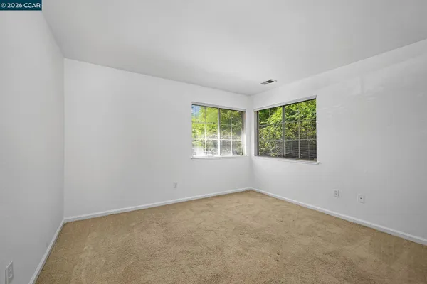 an empty room with windows
