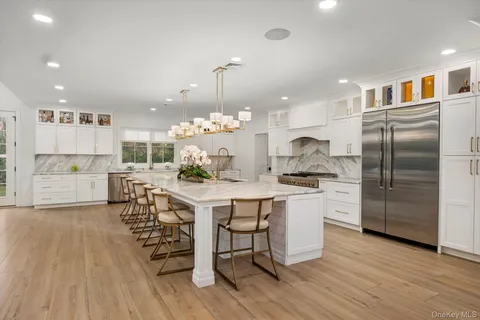 a view of a kitchen and dining room