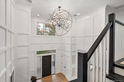 a spacious bedroom with a bed and a table in it