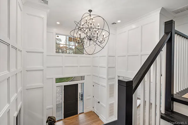 a spacious bedroom with a bed and a table in it